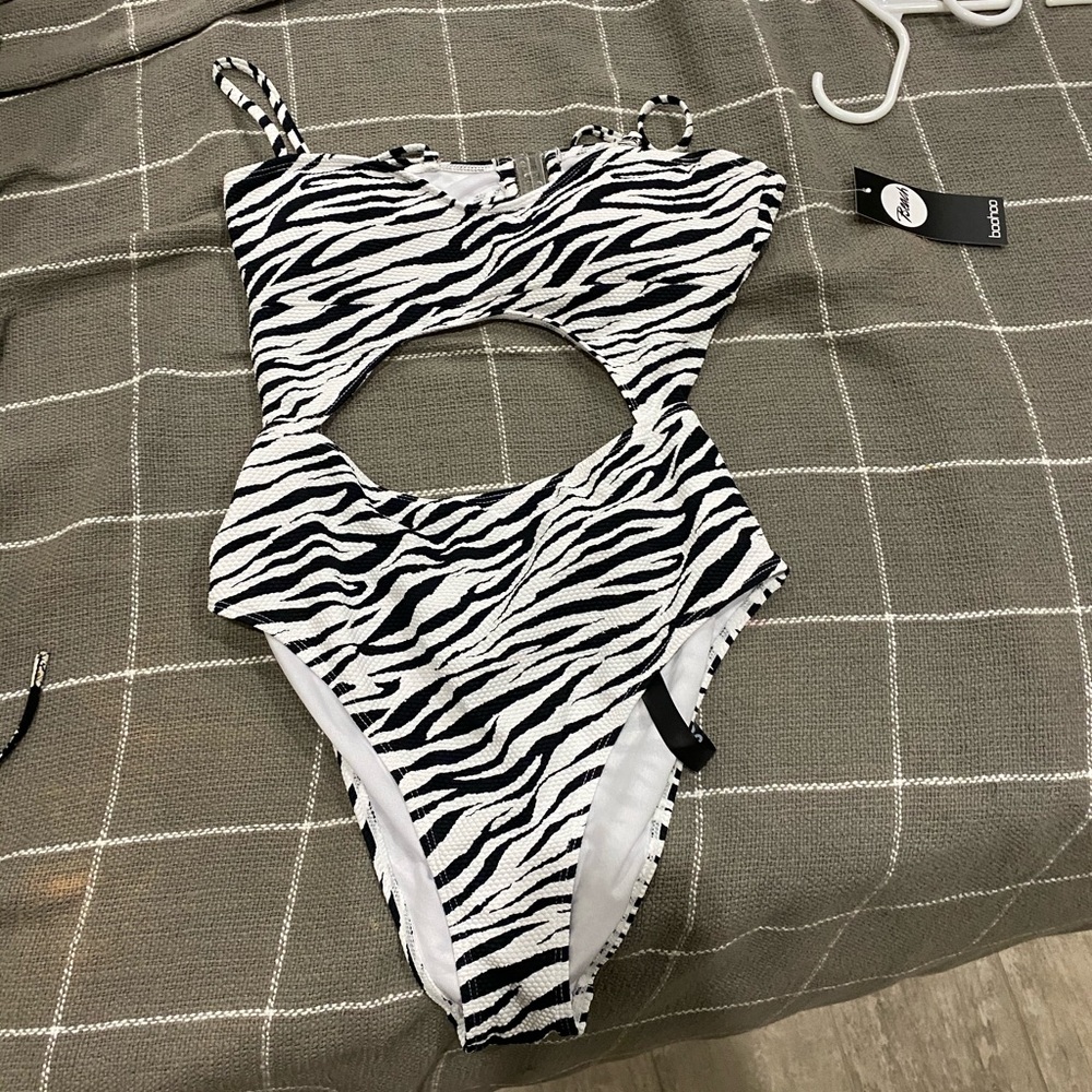 Brand new with tags! Open cut one piece zebra suit
